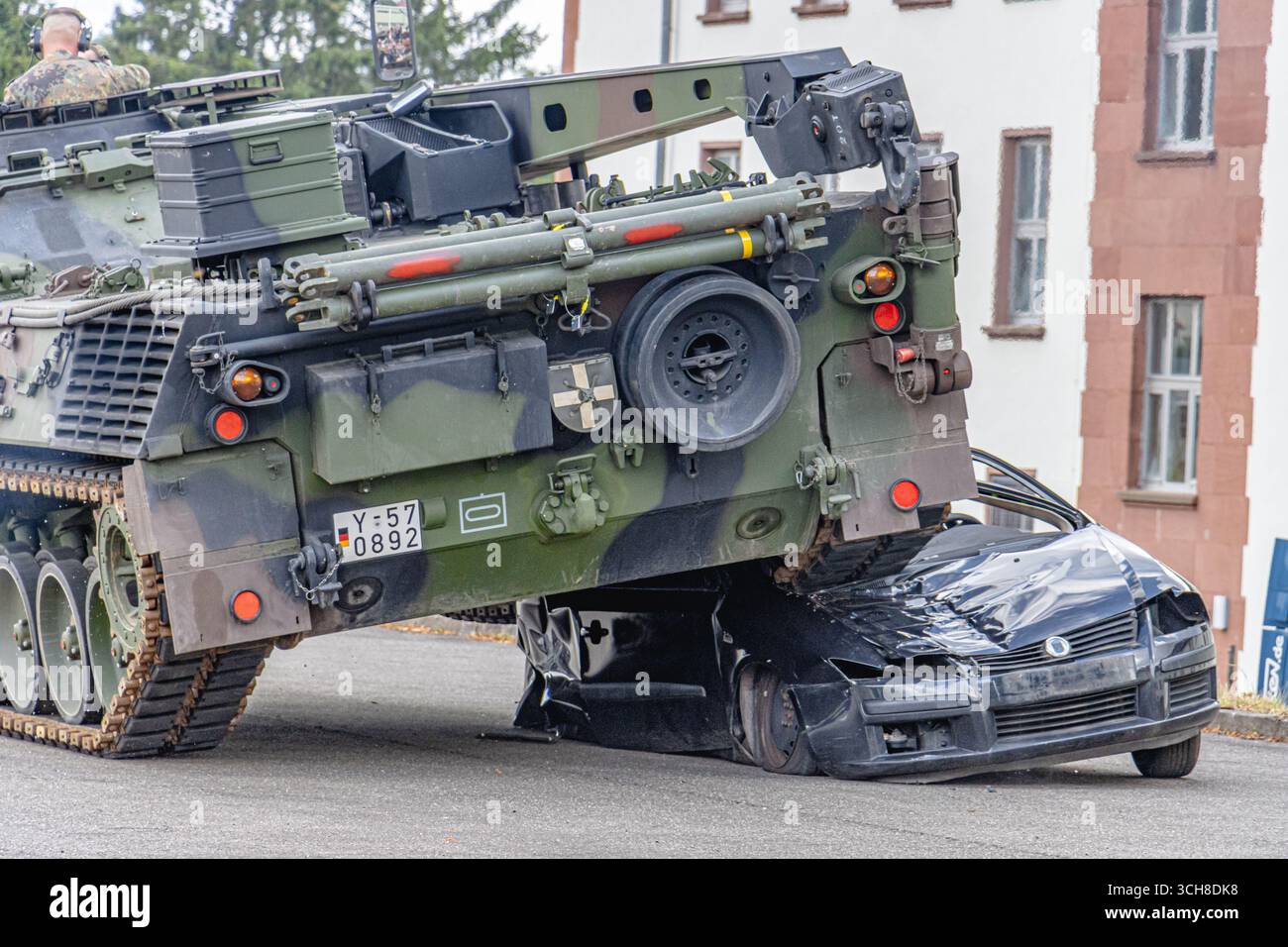 A German Bundeswehr battle tank crushes a car during a training ...