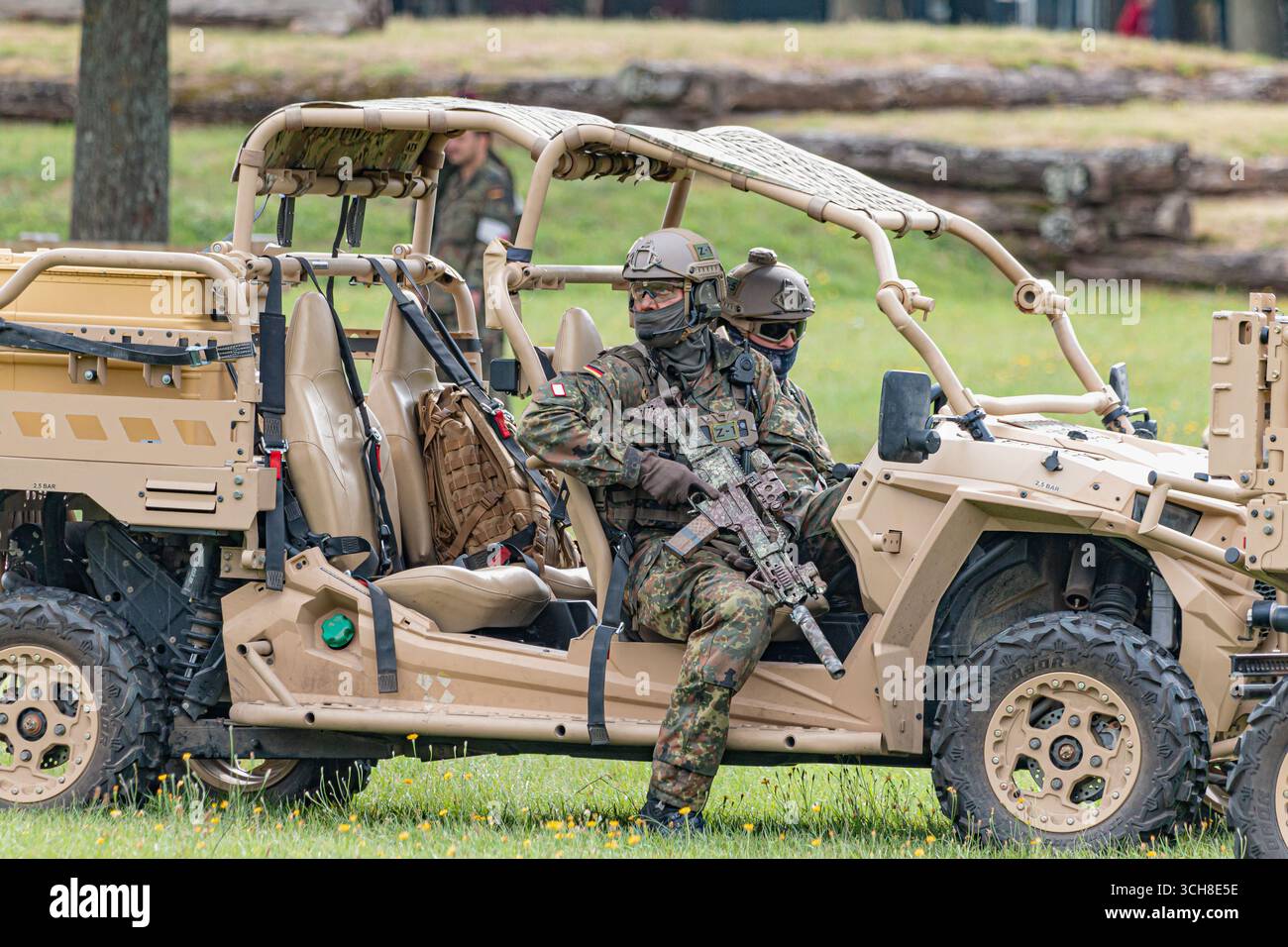 Bundeswehr special forces soldiers ride an off-road buggy during a ...