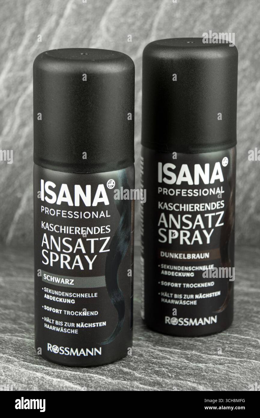 Insana Haar Ansatzspray braunes und schwarzes Haar auf auf Hintergrund grau Stock Photo