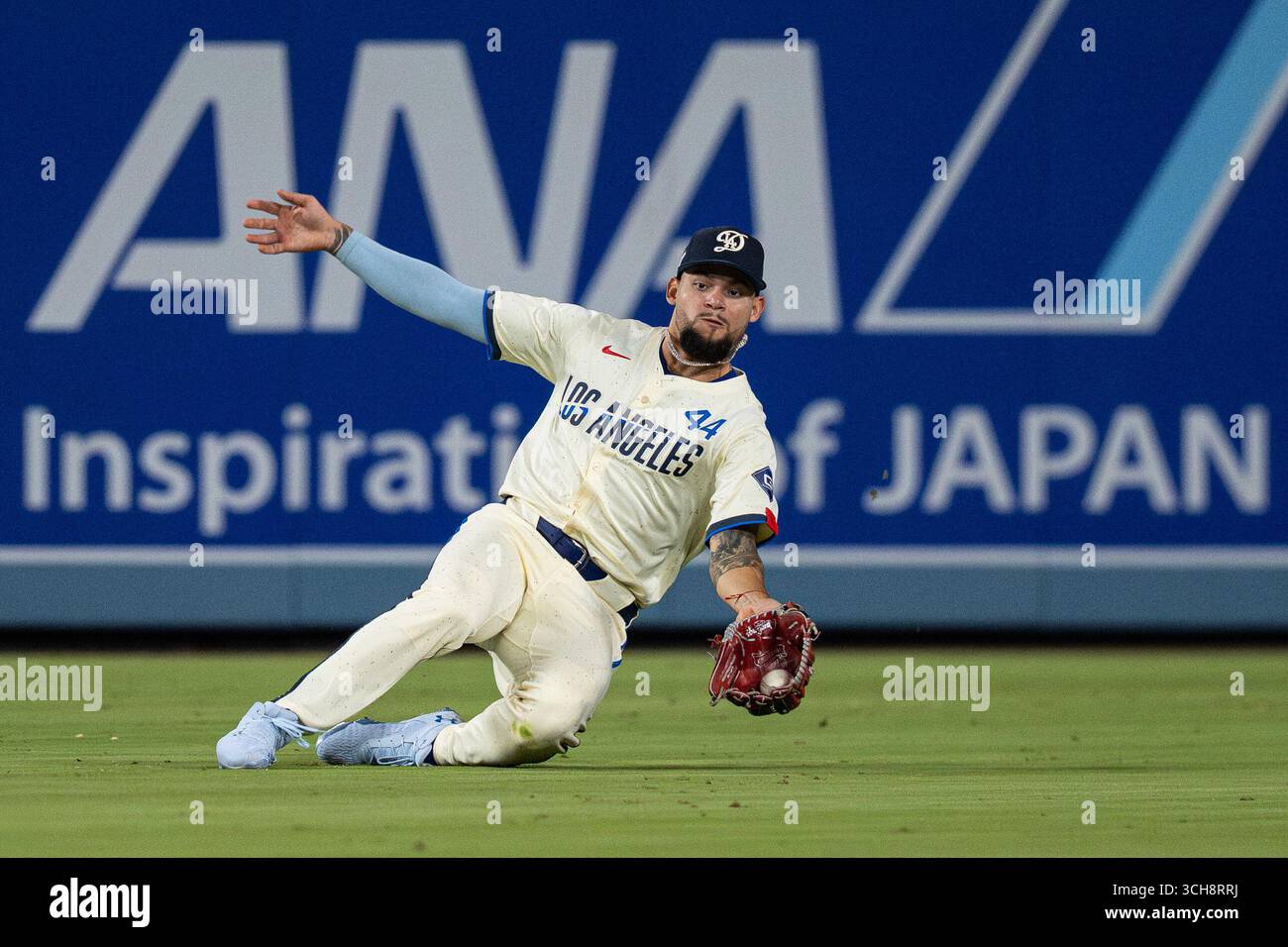 Los Angeles Dodgers outfielder Andy Pages (44) makes a catch during a ...
