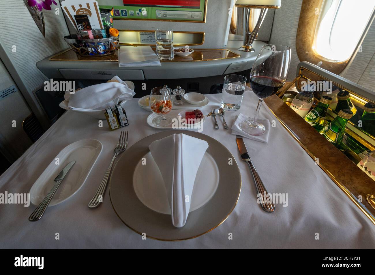 A ‘silver service’ table set for lunch on board an Emirates Boeing 777 ...