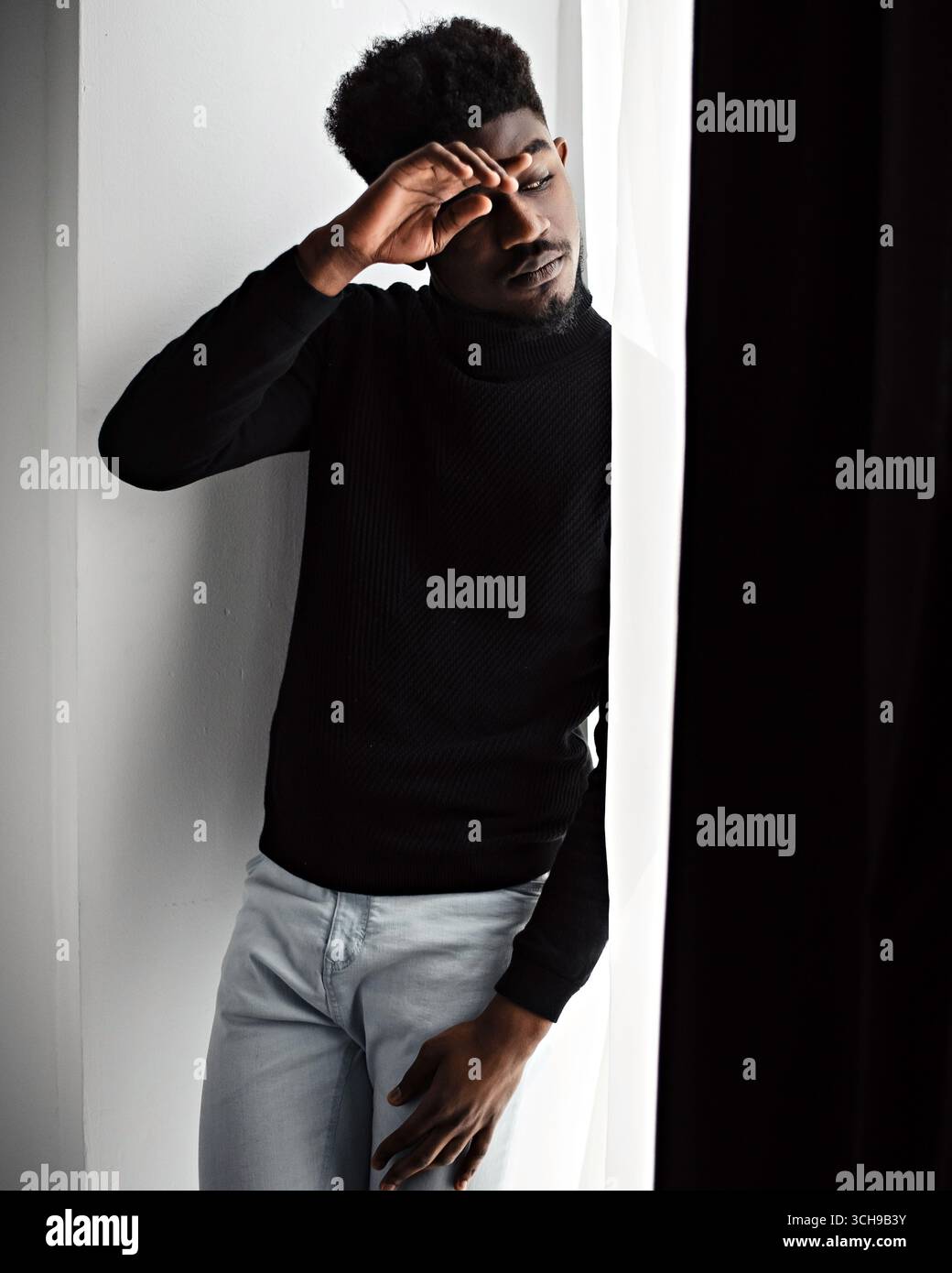 Thoughtful sad black man looking somewhere Stock Photo