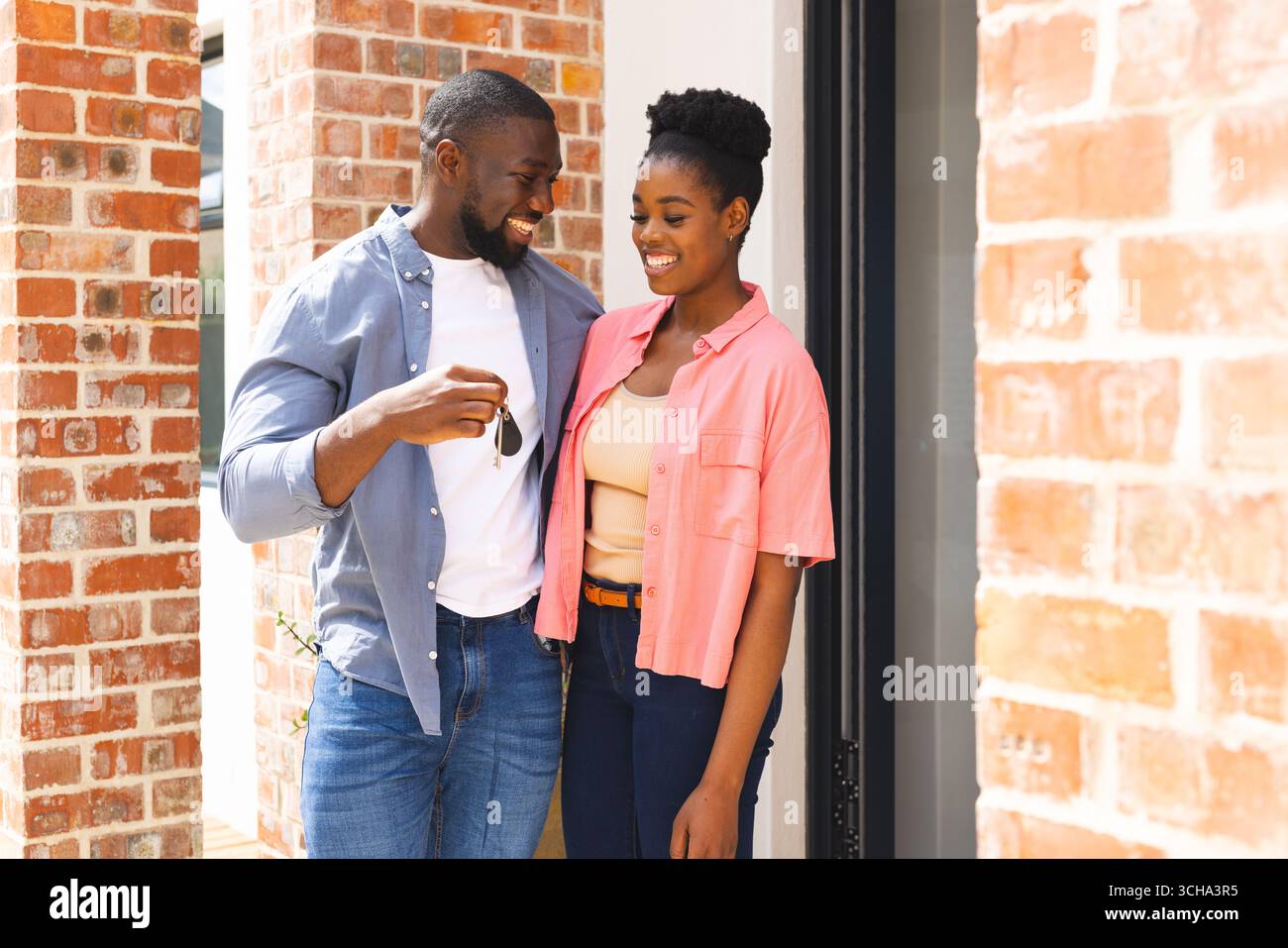 Family smiling outside front door hi-res stock photography and images ...