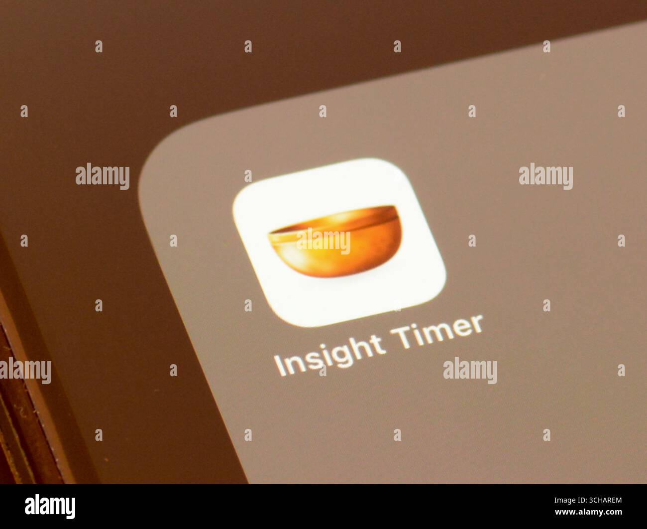 Insight Timer wellbeing and mindfulness app on a smartphone screen Stock Photo