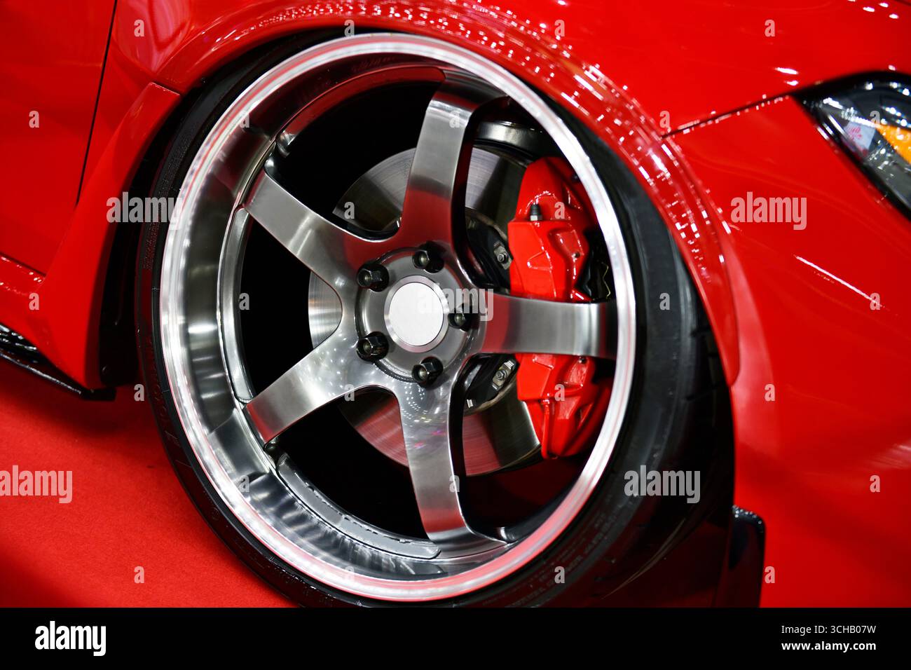 Red car alloy wheel and disc-brake sport car Stock Photo