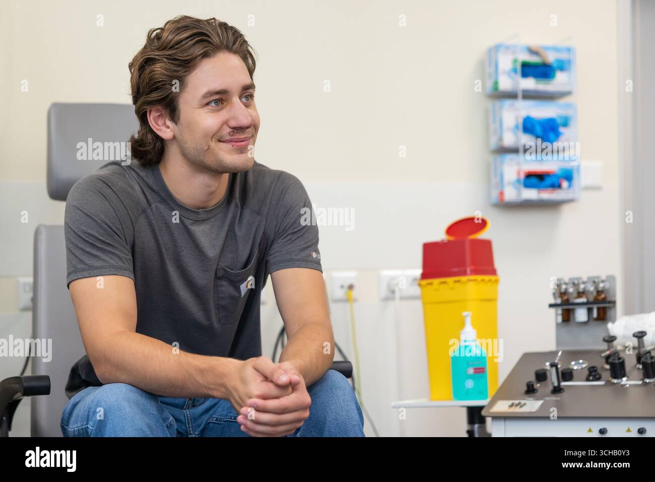 Jonathan Rudat 01 September 2025, Saxony, Dresden: John Rudat sits in a treatment room ...