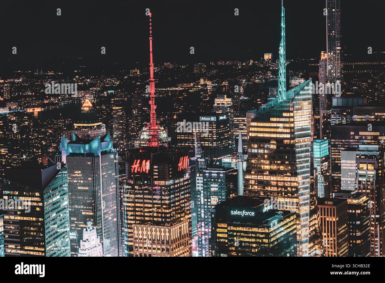 Manhattan’s Midtown skyline at night with illuminated spires and dense city lights. Stock Photo