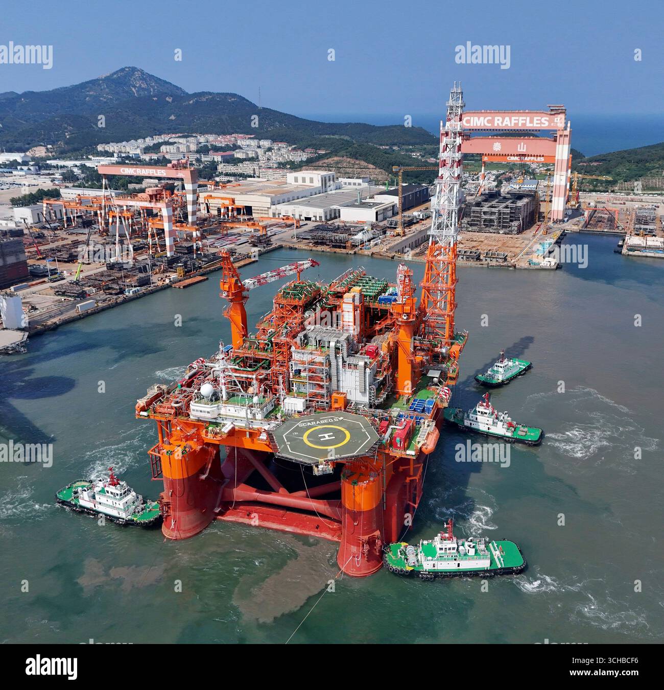 Tugboats push Scarabeo 5, a floating production unit (FPU) converted ...