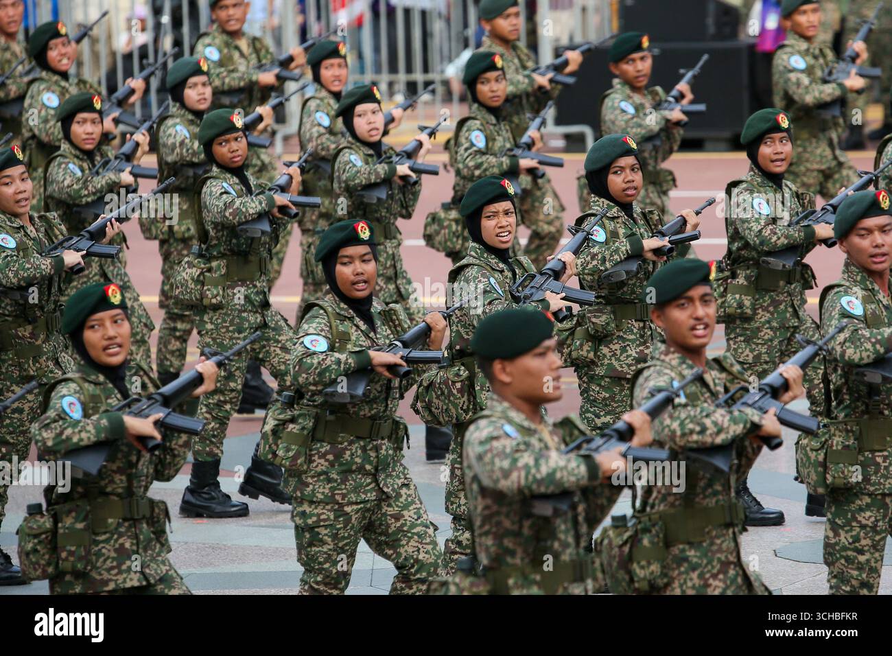 Royal Malay Regiment (RAMD) uniformed contingents march during Malaysia ...