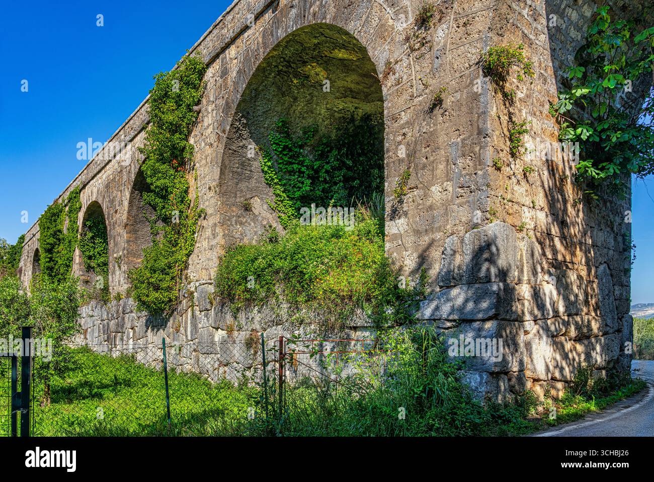 The historic ruins of the arches of the ancient Roman aqueduct in ...