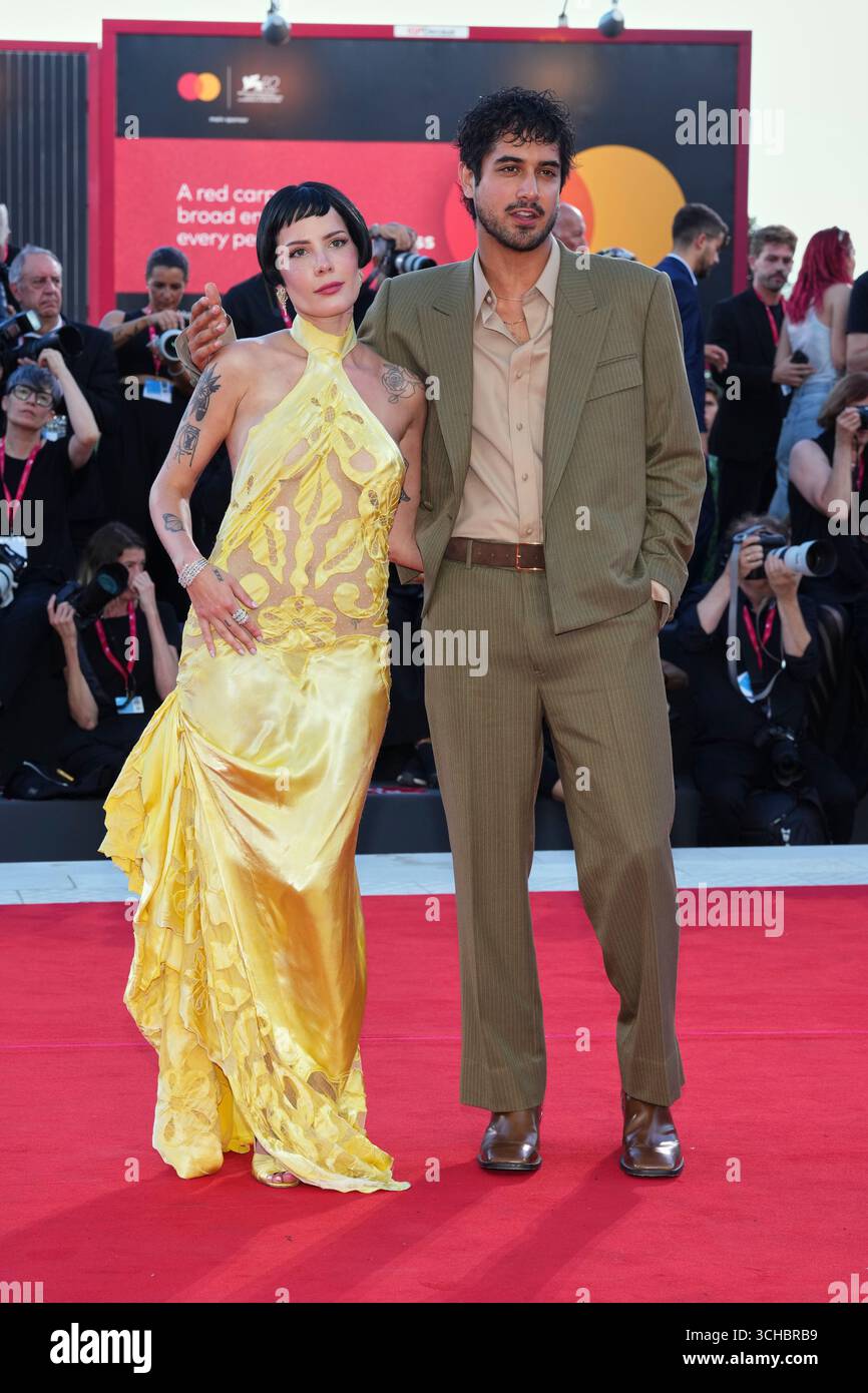 Halsey, left, and Avan Jogia pose for photographers on the red carpet
