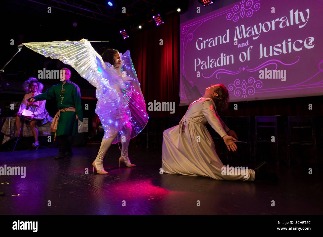 Candidates (r to l) Ry Armstrong, Erika Evans and Rory O’Sullivan perform in a lip sync battle during 'Candidate Survivor' at Neumos in Seattle on Thu Stock Photo