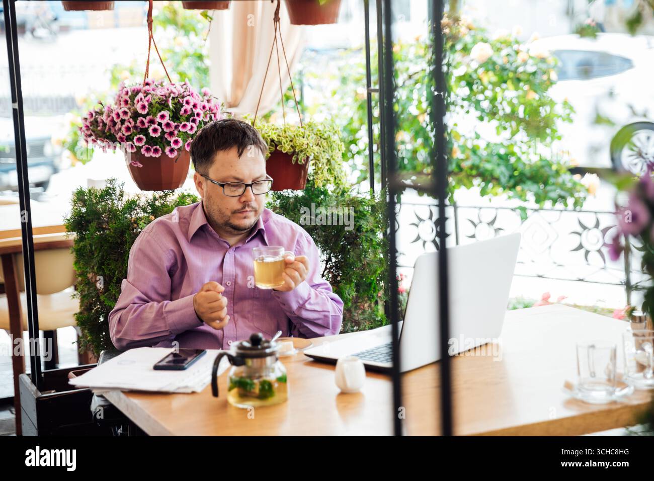 Businessman Working on Laptop in Cafe, Business Person Work At Hotel Table, Stock Photo