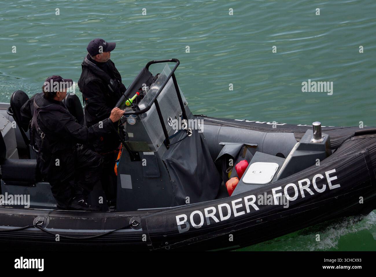Border Force officers aboard a rugged inflatable boat in Dover harbour ...