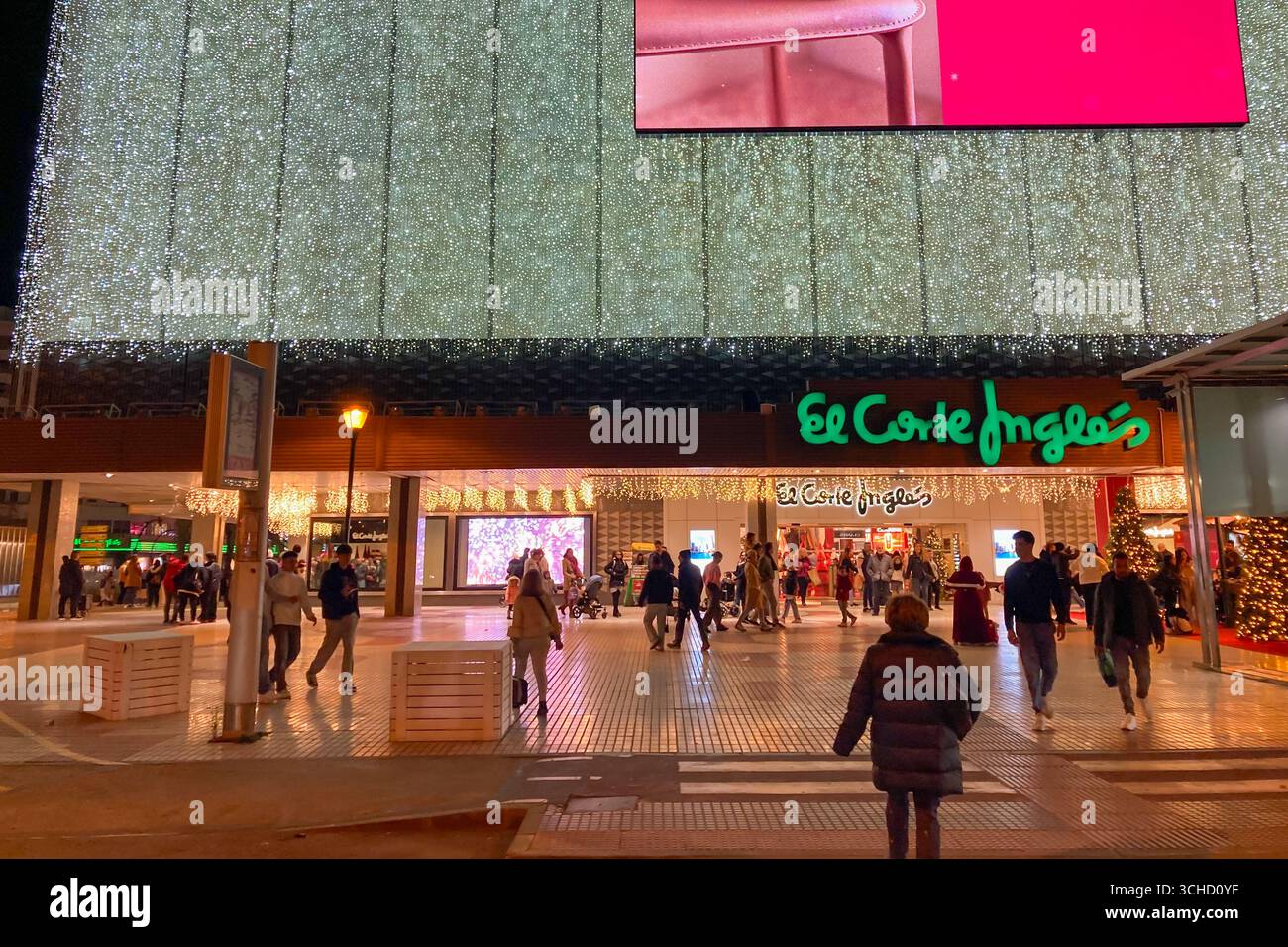 MALAGA, SPAIN - DECEMBER 21, 2024: The city center glows with enchanting Christmas decorations, creating a festive wonderland in Malaga, Spain - Smartphone Captured Stock Image