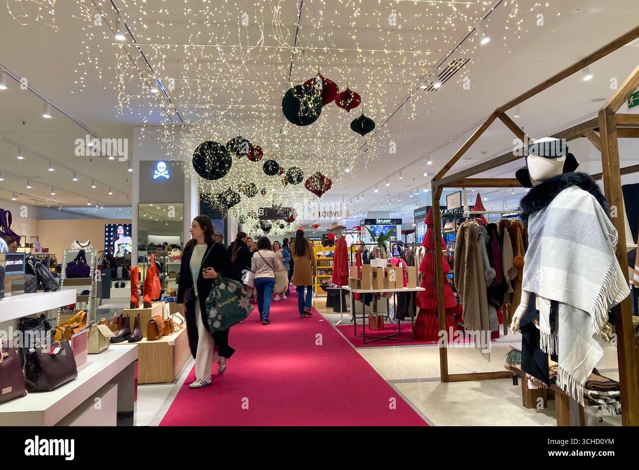 MALAGA, SPAIN - DECEMBER 21, 2024: The city center glows with enchanting Christmas decorations, creating a festive wonderland in Malaga, Spain - Smartphone Captured Stock Image