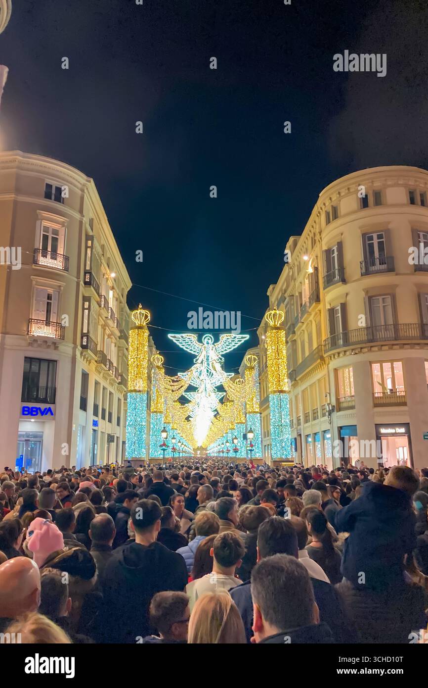 MALAGA, SPAIN - DECEMBER 21, 2024: The city center glows with enchanting Christmas decorations, creating a festive wonderland in Malaga, Spain - Smartphone Captured Stock Image