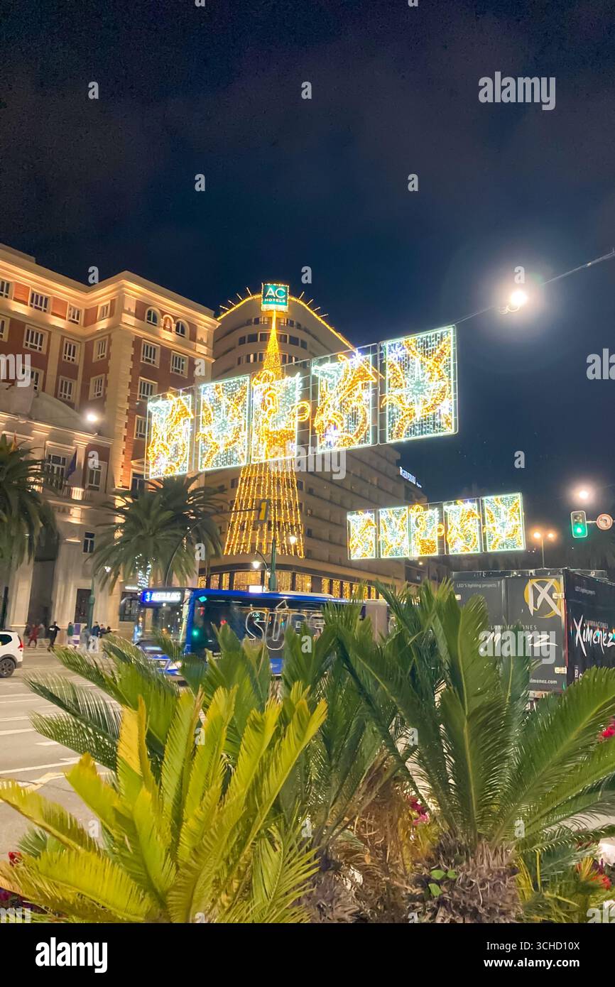 MALAGA, SPAIN - DECEMBER 21, 2024: The city center glows with enchanting Christmas decorations, creating a festive wonderland in Malaga, Spain - Smartphone Captured Stock Image