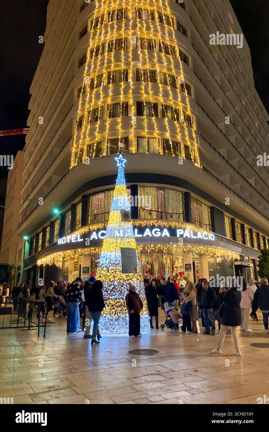 MALAGA, SPAIN - DECEMBER 21, 2024: The city center glows with enchanting Christmas decorations, creating a festive wonderland in Malaga, Spain - Smartphone Captured Stock Image