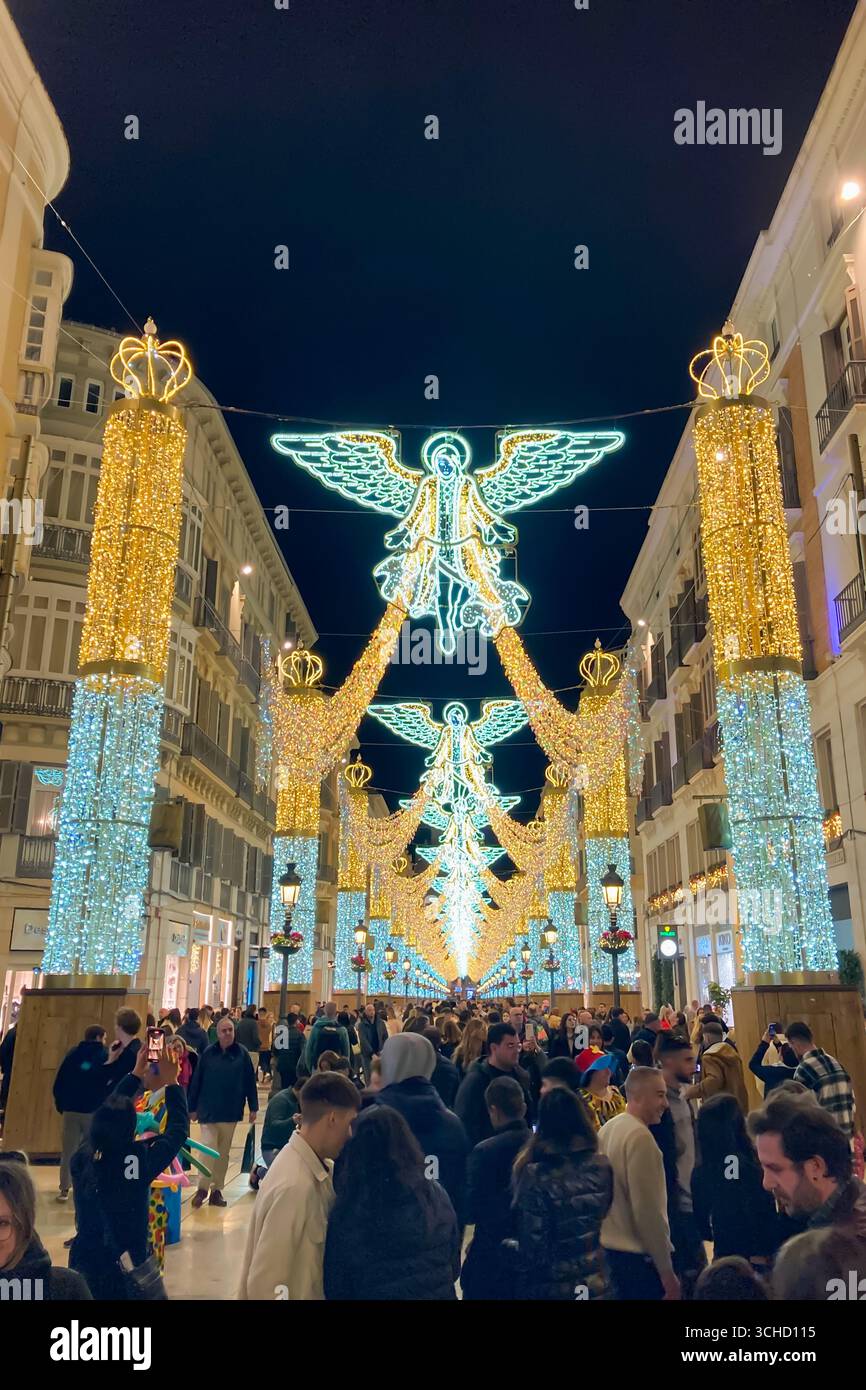 MALAGA, SPAIN - DECEMBER 21, 2024: The city center glows with enchanting Christmas decorations, creating a festive wonderland in Malaga, Spain - Smartphone Captured Stock Image