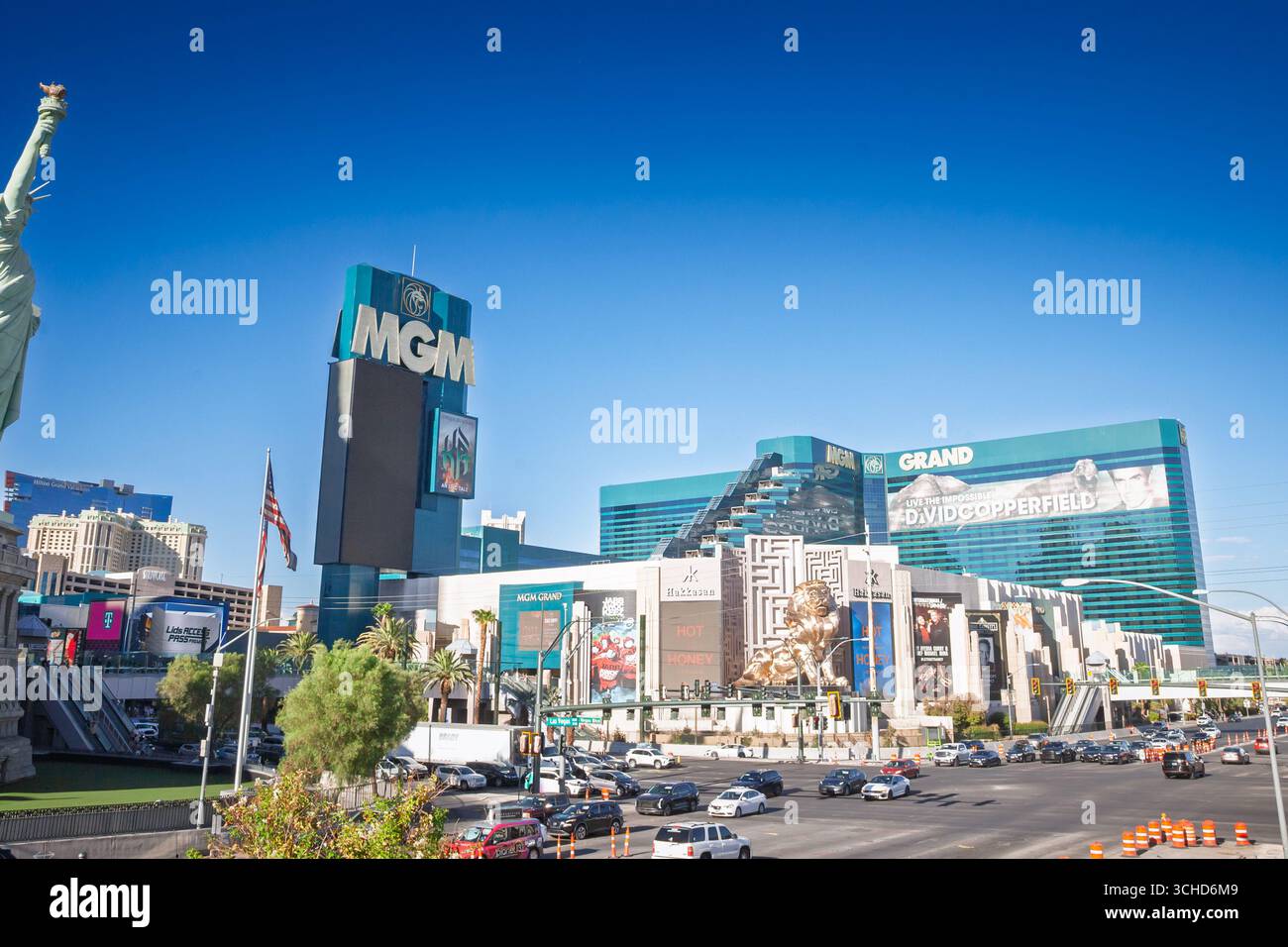 LAS VEGAS - AUGUST 23, 2024: MGM Grand complex on the Las Vegas Strip, with teal glass towers, the gold MGM lion statue and large billboards, MGM Reso Stock Photo