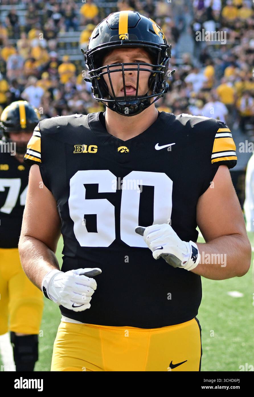 IOWA CITY, IA - AUGUST 30: Iowa right guard Lucas Allgeyer (60) warms ...