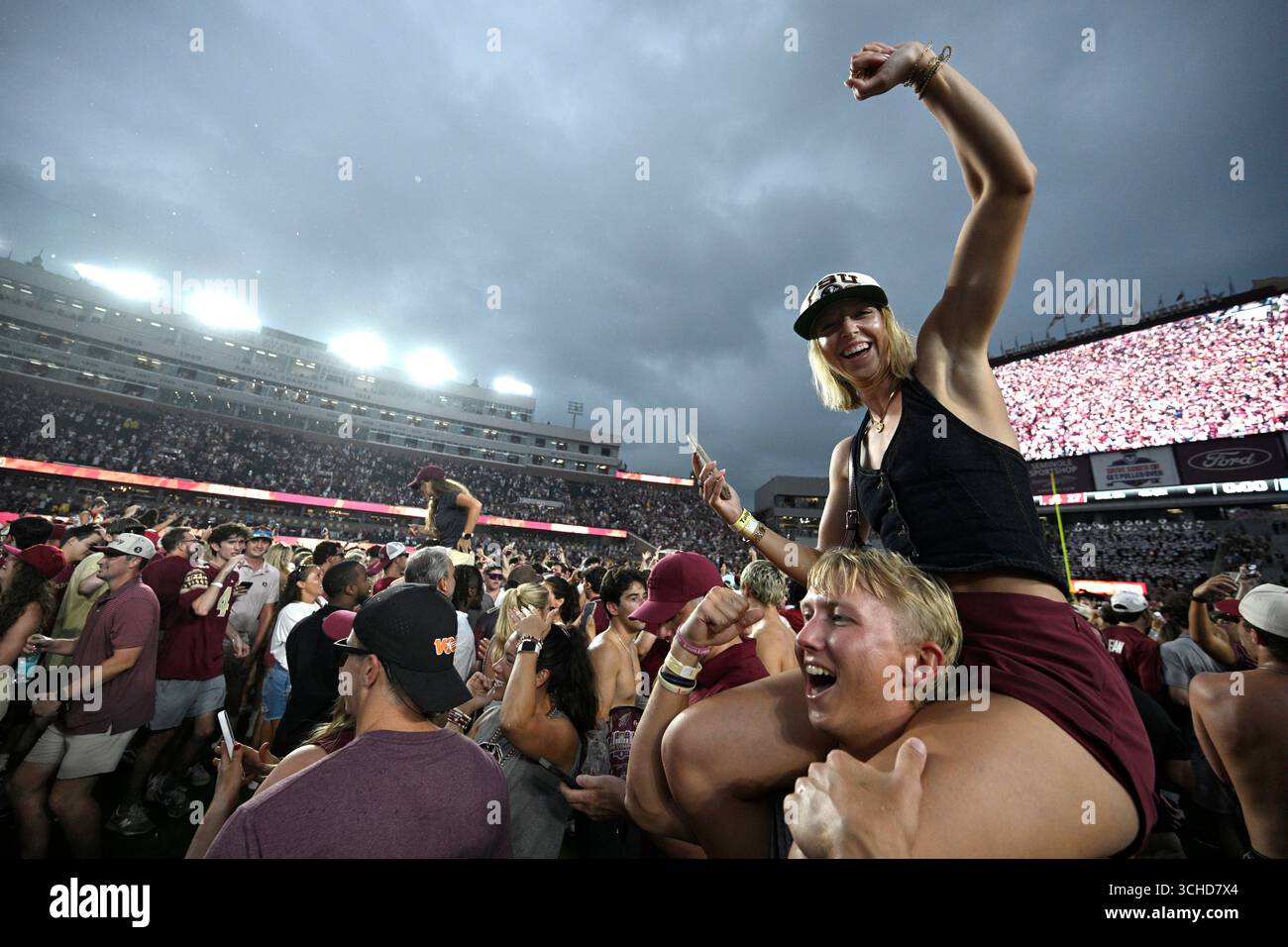 Florida State fans celebrate on the field after a win against Alabama ...