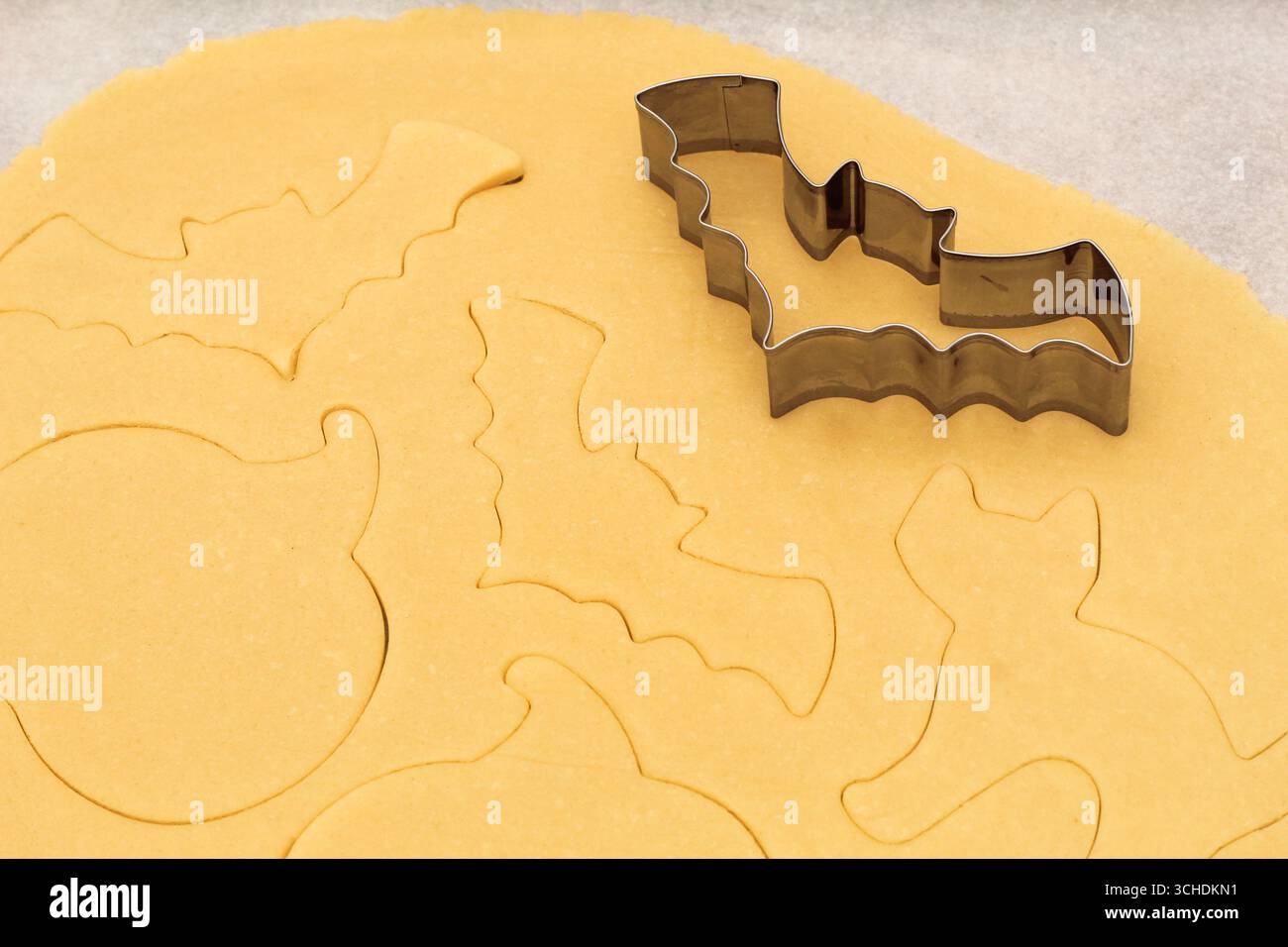 Halloween Bat Cookie Cutter on Cookie Dough Stock Photo
