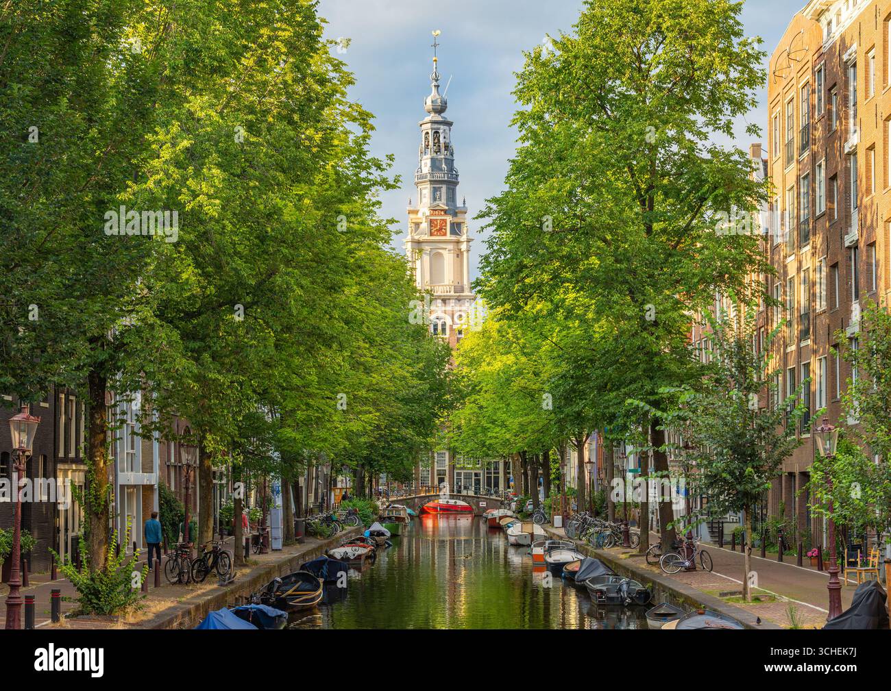 Amsterdam in the summer, famous Zuiderkerk church Tower seen from the canal Stock Photo