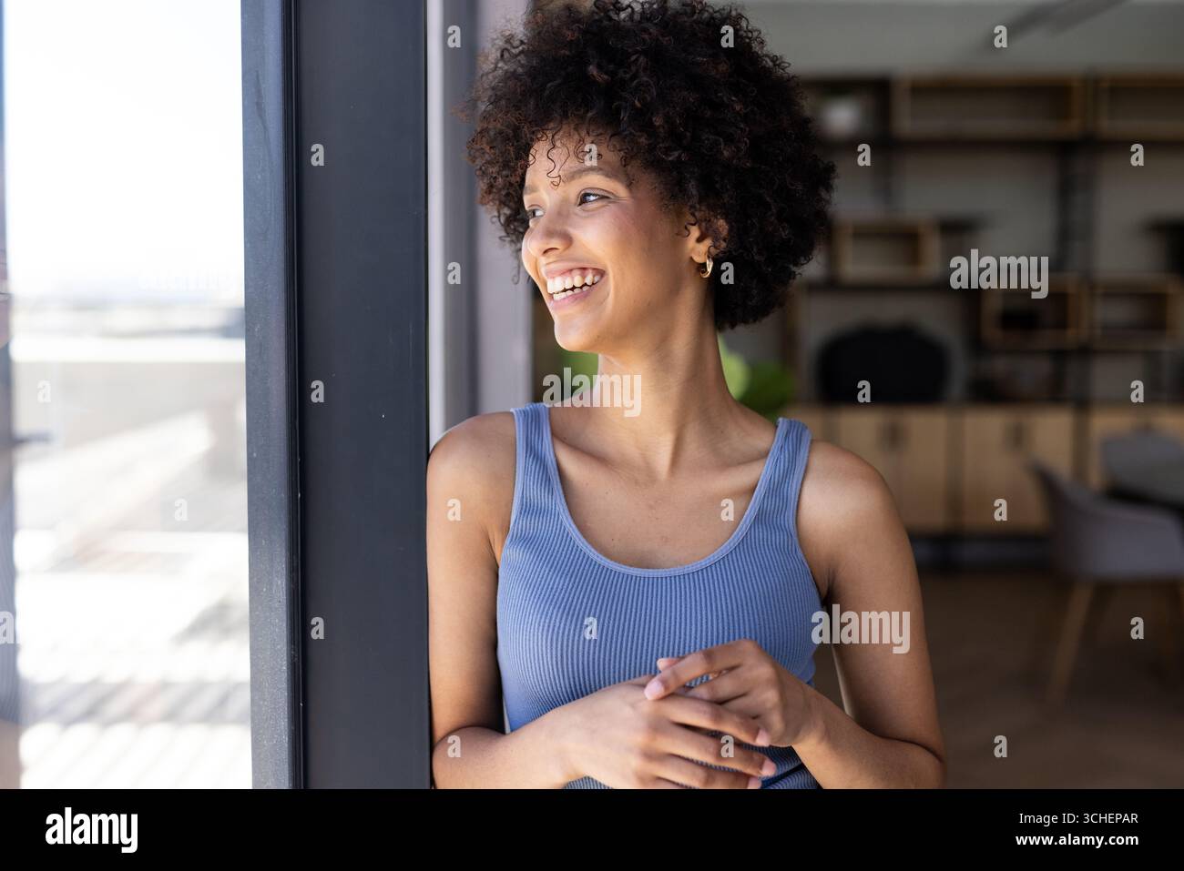 Woman in blue top hi-res stock photography and images - Alamy