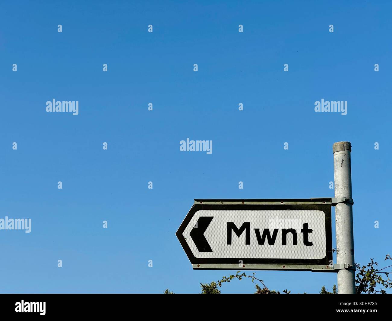 A roadsign pointing towards Mwnt, Wales - Smartphone Captured Stock Image