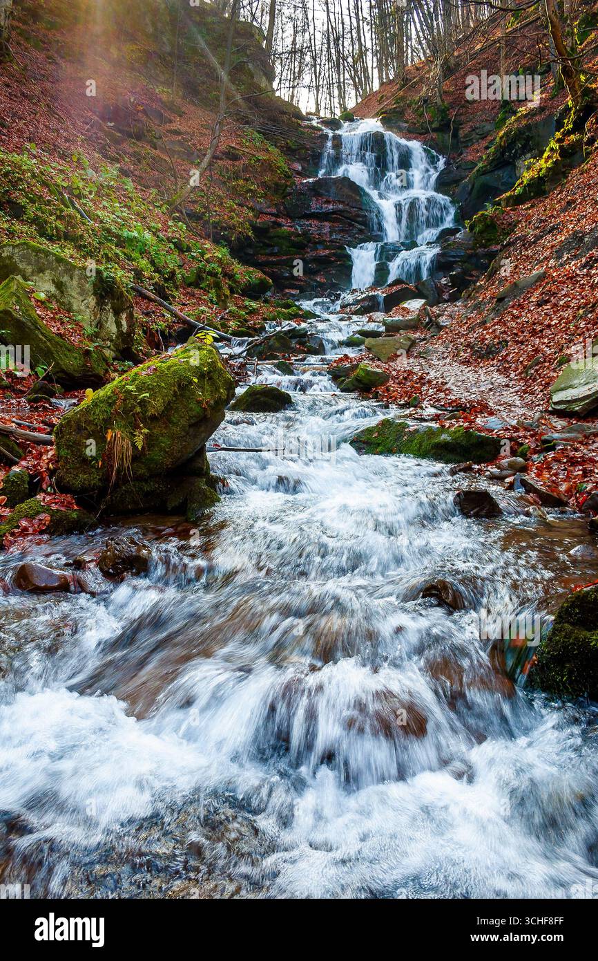 beautiful autumn scenery near the waterfall shypot. popular travel destination of Ukrainian Carpathians. mossy rocks near water stream. steep slopes i Stock Photo