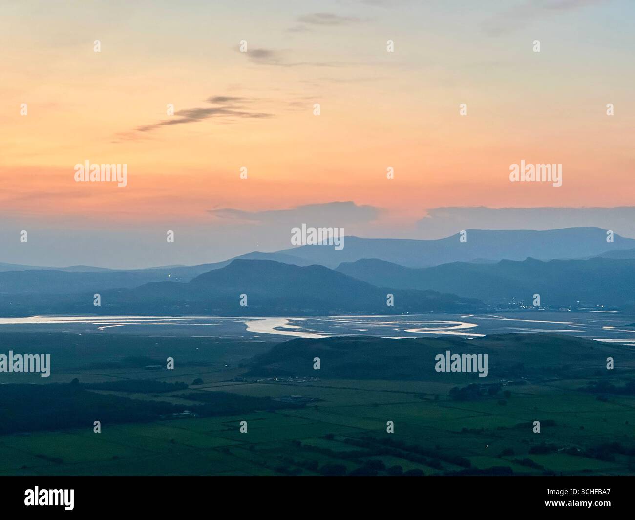 View over the Dwyryd estuary and the Eryri National Park at sunset in late summer - Smartphone Captured Stock Image