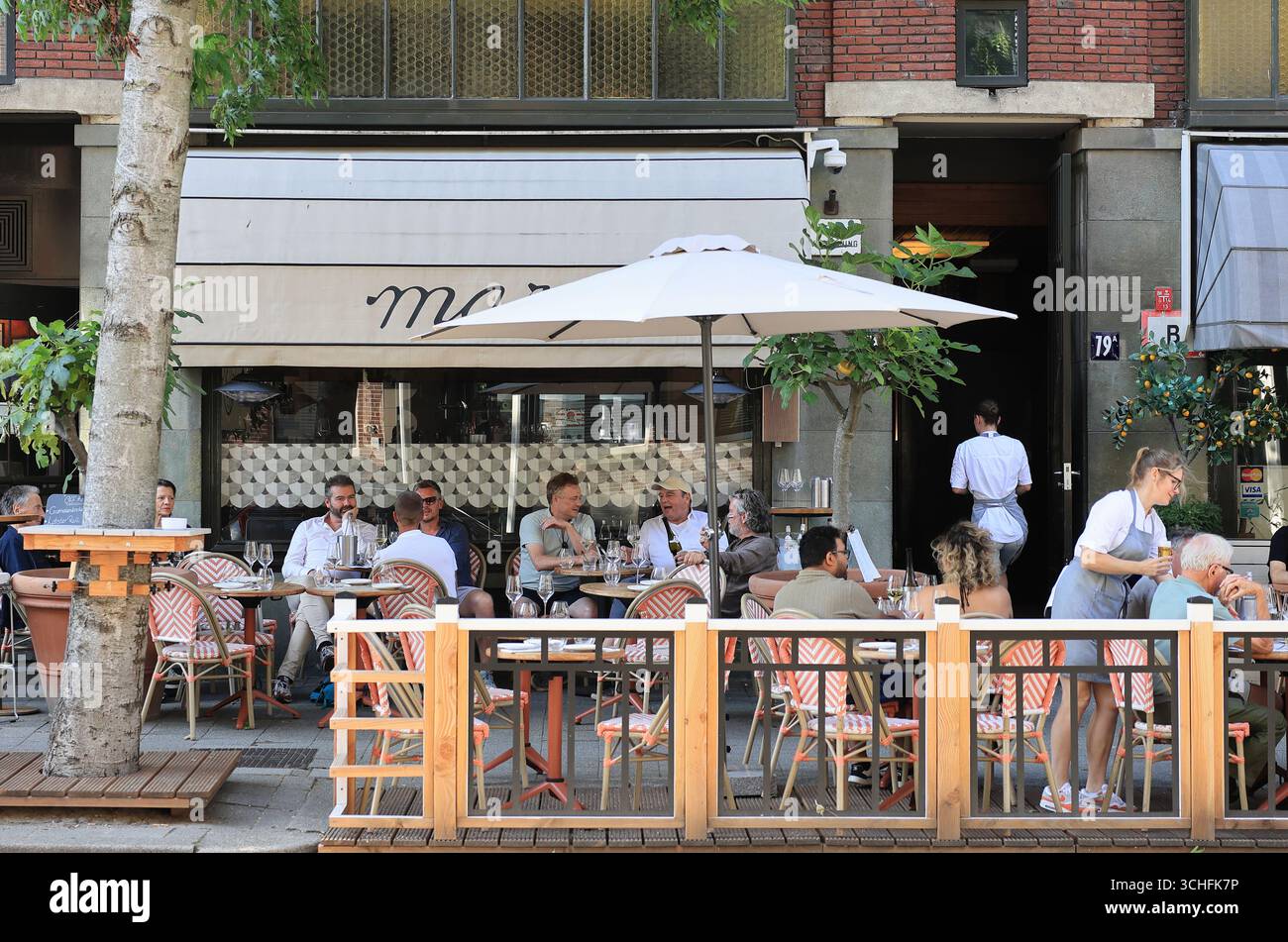 Restaurants on Westerstraat, in a lovely neighbourhood near the city park, Rotterdam, Netherlands. Stock Photo