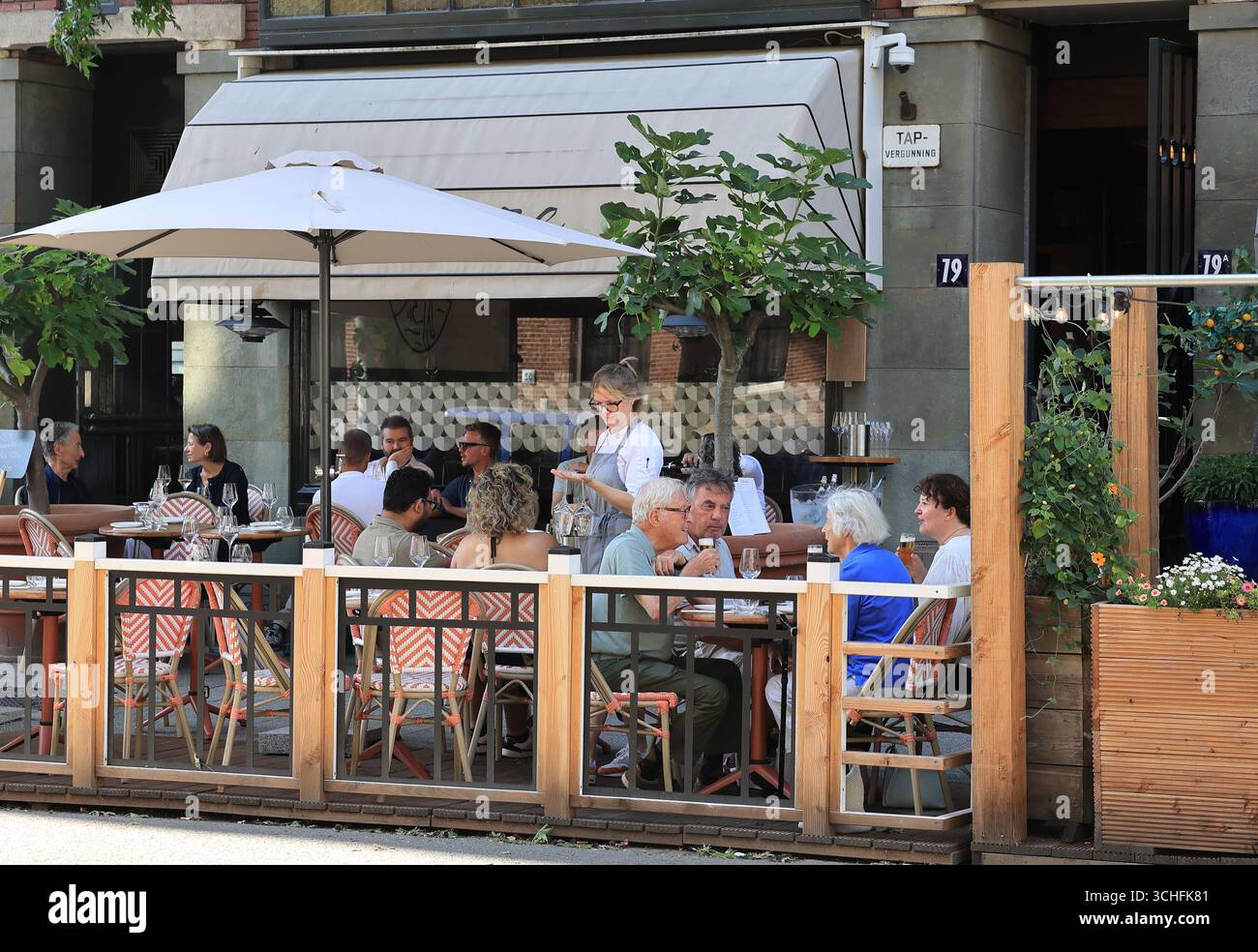 Restaurants on Westerstraat, in a lovely neighbourhood near the city park, Rotterdam, Netherlands. Stock Photo