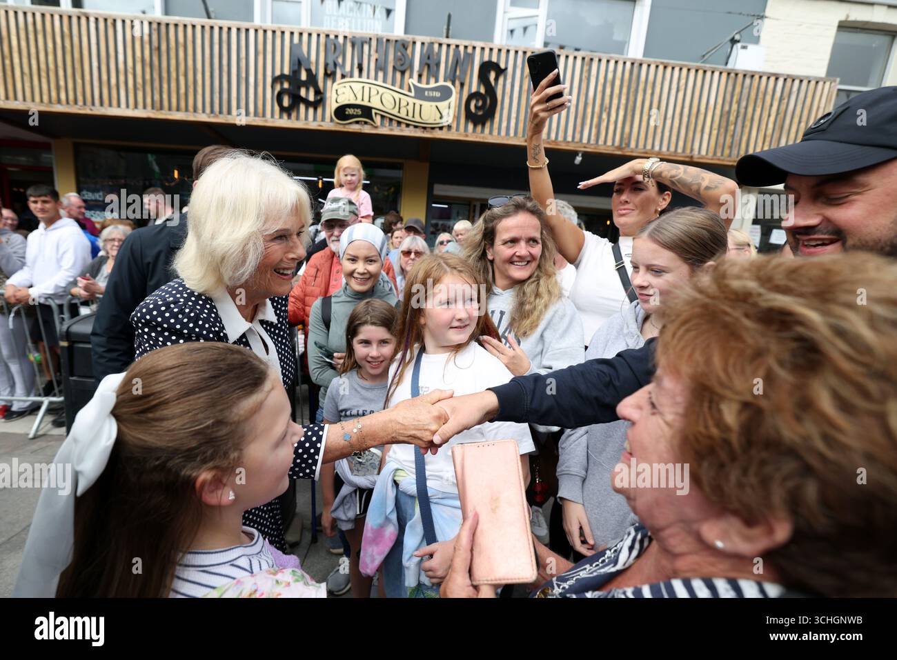 Queen Camilla meets members of the public during her visit to Newquay to  see local projects supported by the Cornwall Community Foundation, of which  she has been Patron since 2005. Picture date: