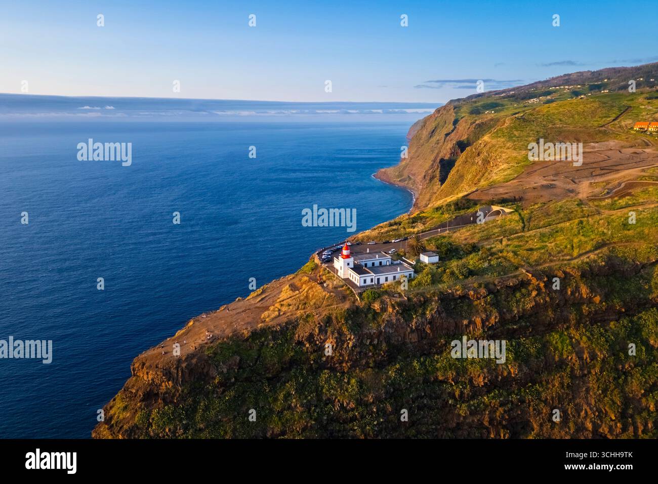 Aerial view of the amazing lighthouse called Farol da Ponta do Pargo at sunset in spring. Madeira, Portugal, Europe. Stock Photo