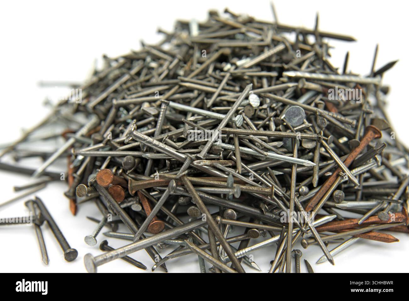 Many different nails against a white background Stock Photo