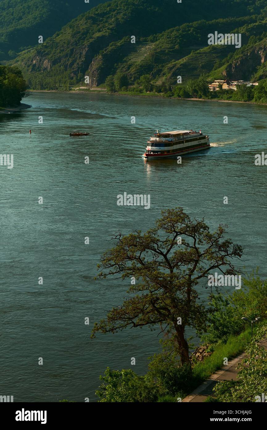 Vertical view of the Danube River in Austria, showing a cruise ship, a ...
