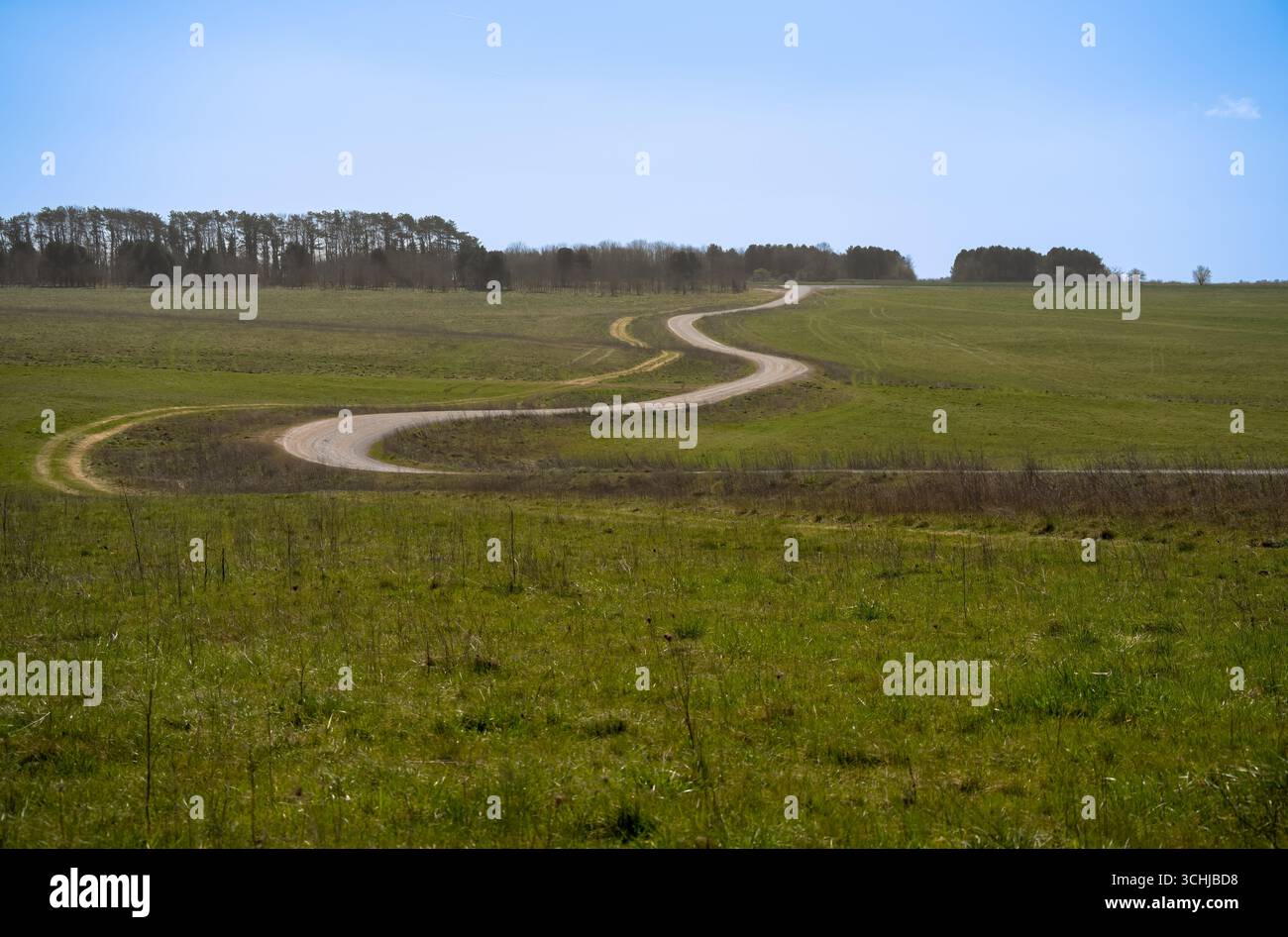 a winding stone track road disappearing on the horizon Stock Photo - Alamy