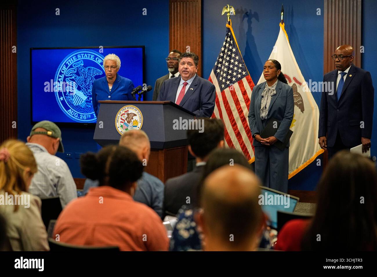 Illinois Gov. JB Pritzker, center, speaks during a press conference ...