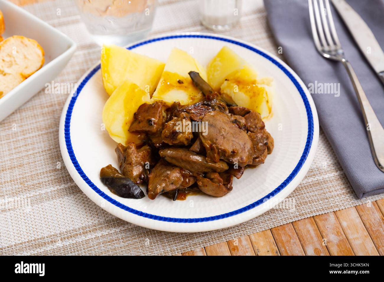 Fried rabbit liver served with boiled potato Stock Photo
