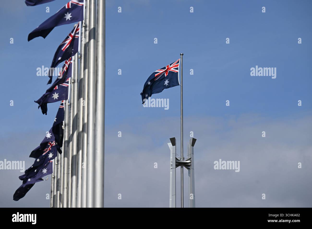 The Australian flag flys on top of Parliament House in Canberra ...