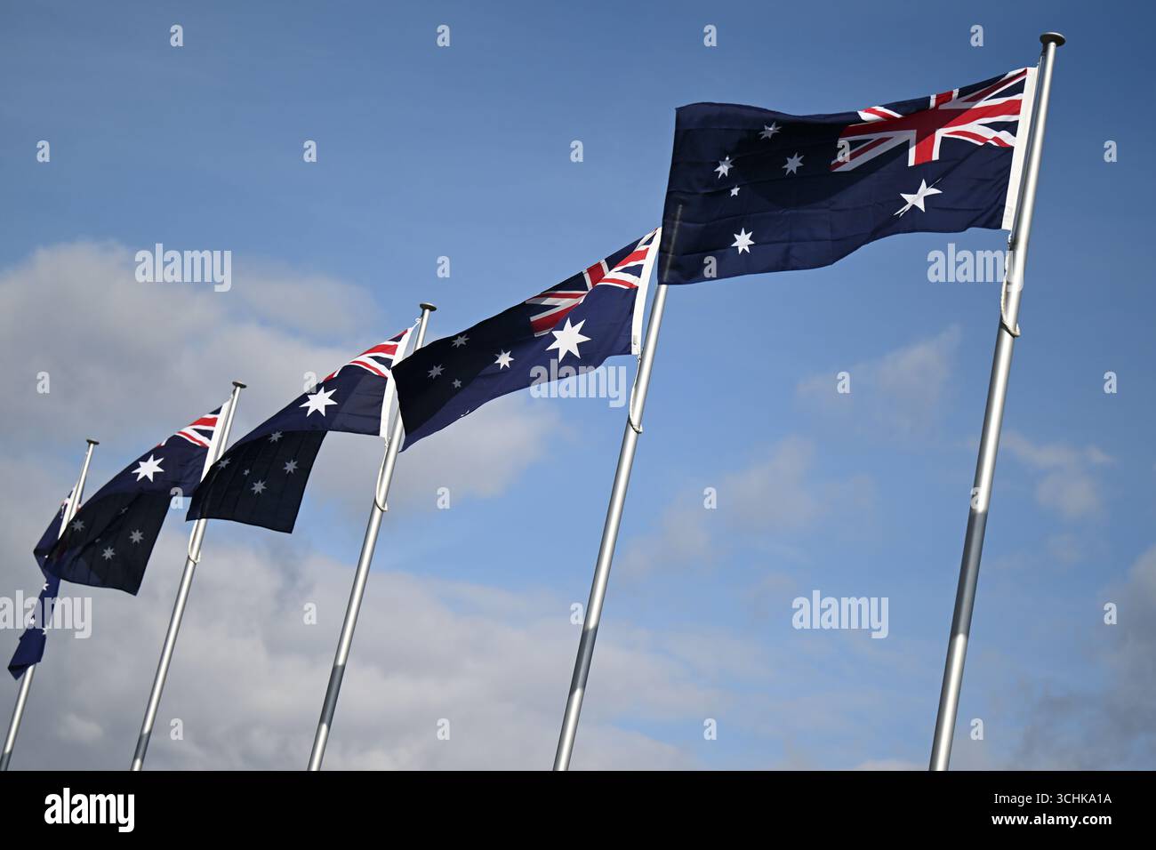 The Australian flag flys on top of Parliament House in Canberra ...