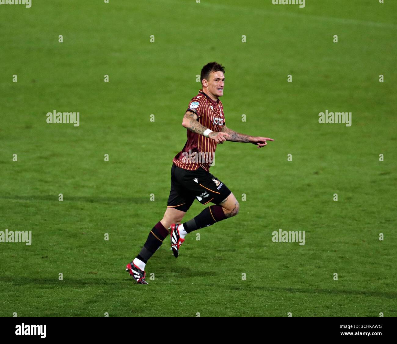 Andy Cook of Bradford City celebrates his first goal during The Vertu ...
