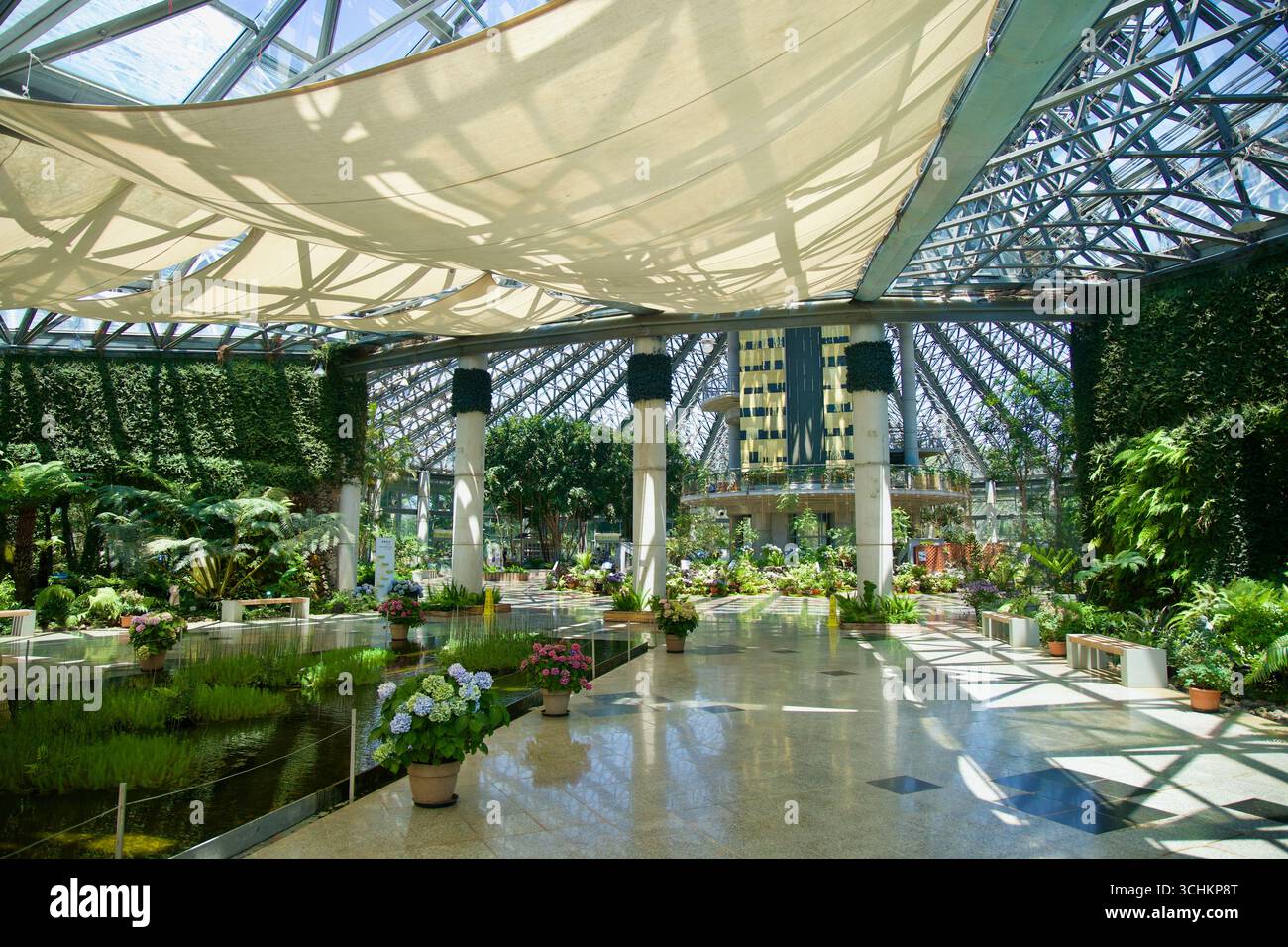 Botanic Atrium A wide atrium scene inside Yeomiji Botanical Garden, with ponds ...