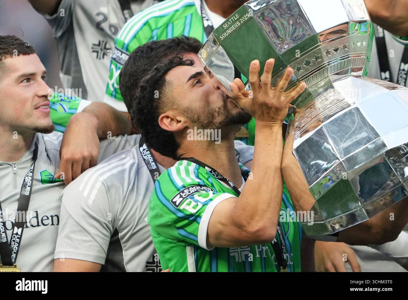 Seattle Sounders midfielder Cristian Roldan kisses the Leagues Cup ...