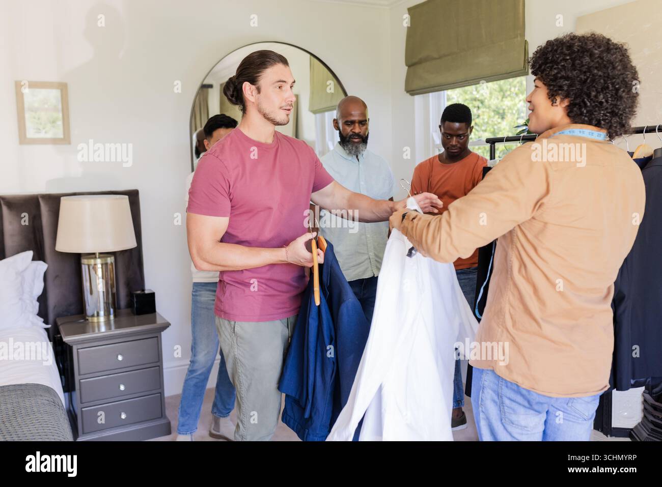 Groom friends preparing suits hi-res stock photography and images - Alamy