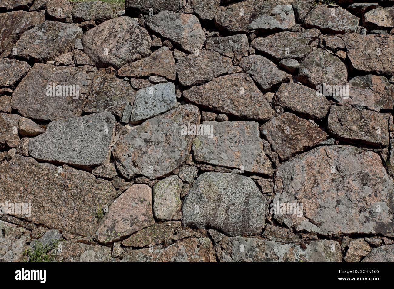 Closeup of old stone wall background texture. Stock Photo