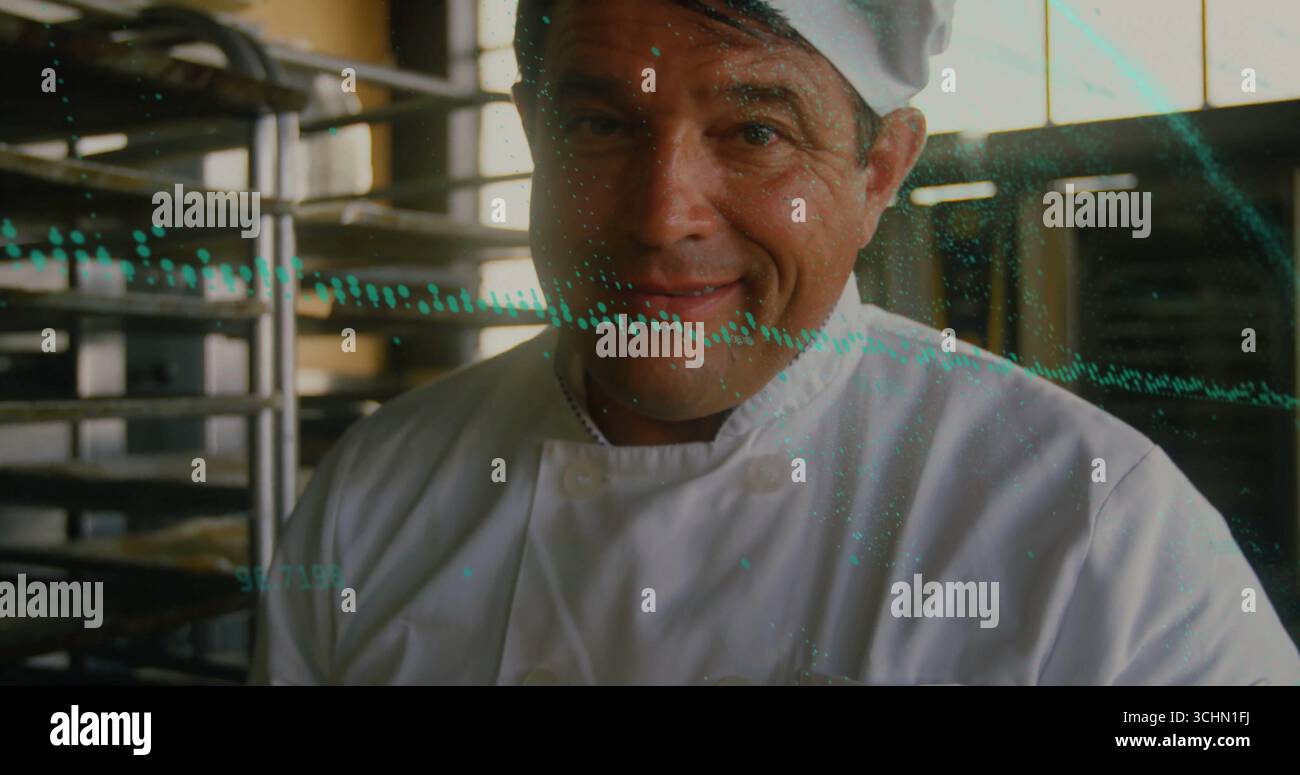 Working chef wearing white coat tall hat handling stainless rack trays in bakery with teal overlay Stock Photo